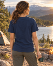 Woman holding a camping mug and showing the plain back of the True Navy Midnight Mountain Camp Tee