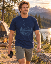 Man walking toward the camera with binoculars in the True Navy Midnight Mountain Camp Tee at a mountain campsite