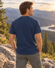 Man showing the plain back of the True Navy Midnight Mountain Camp Tee in the mountains
