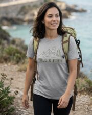 Woman wearing the Wild & Free Mountain Tee on an outdoor trail