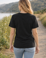 Back view of a model wearing a dark Bella+Canvas 3001 T-shirt.