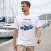 Man wearing the white Rowing Club coastal T-shirt at a marina.