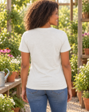 Woman wearing the Cultivate Your Passion gardening T-shirt while gardening