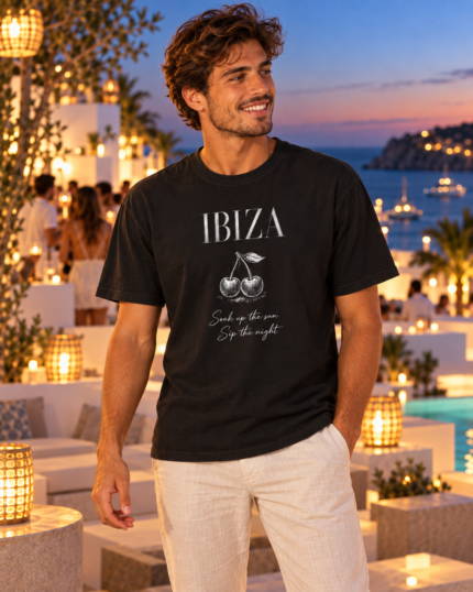 Man standing on an Ibiza terrace wearing the black Ibiza cherry graphic T-shirt
