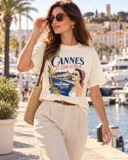 Woman wearing the ivory Cannes Côte d’Azur Comfort Colors 1717 tee at Cannes marina