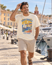 Man walking along the Saint-Tropez harbour quay in the ivory Saint-Tropez Côte d'Azur Comfort Colors tee