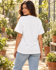 Back view of a woman wearing a plain white Comfort Colors botanical patchwork tee