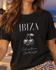 Close-up of a woman wearing the black Ibiza cherry graphic Comfort Colors tee