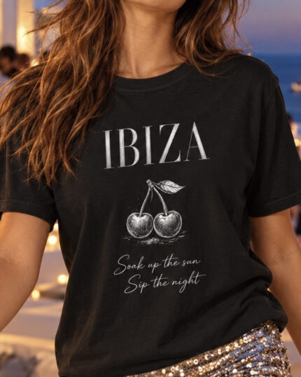 Close-up of a woman wearing the black Ibiza cherry graphic Comfort Colors tee