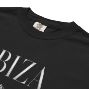 Close-up of the garment-dyed black fabric, collar, and Ibiza print detail