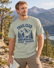 Man wearing the Bay Trail Club tee in a three-quarter view at a mountain overlook.