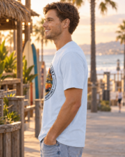 Side view of a model wearing the California Surf retro van T-shirt in light blue.