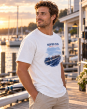 Man wearing the white Rowing Club Coastal Tee in a three-quarter view at a marina