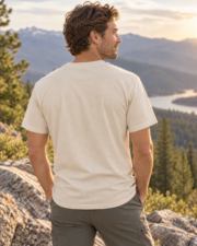 Man showing the plain back of the natural Wild & Free Mountain Tee