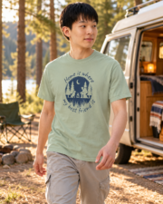 Man walking beside a camper van wearing the Bay camping dog graphic tee, three-quarter view