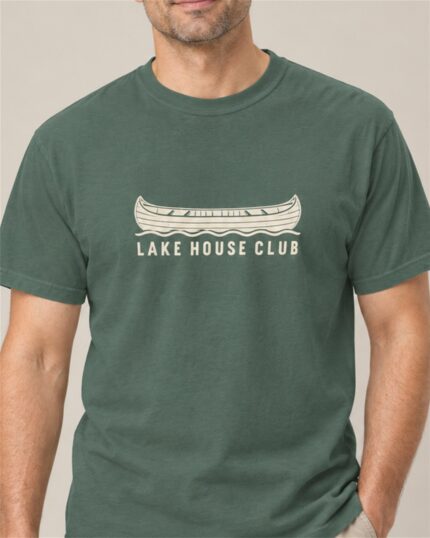 Man wearing the Blue Spruce Lake House Club Canoe T-shirt, close-up of the canoe print