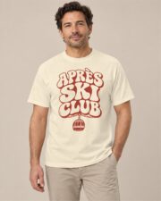 Man wearing the Ivory Après Ski Club Retro T-shirt, front view, studio