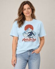 Woman wearing the Chambray Après Ski Club Skier T-shirt, front view, studio