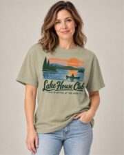 Woman wearing the Khaki Lake House Club Sunset T-shirt, front view, studio