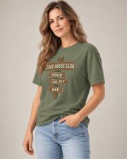 Woman wearing the Moss Lake House Club Signpost T-shirt, three-quarter view, studio