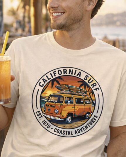 Model wearing the California Surf retro van T-shirt in a coastal lifestyle setting.