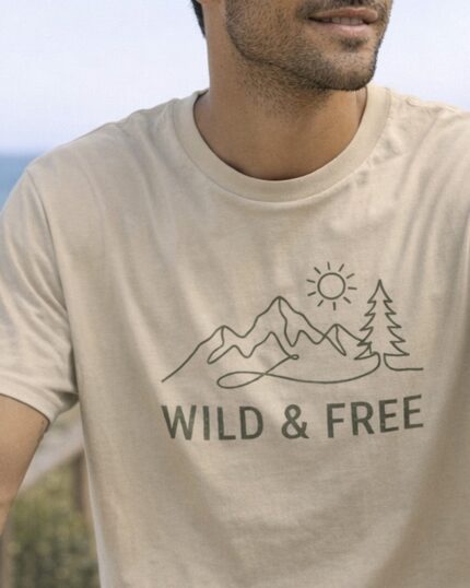 Man wearing the natural Wild & Free Mountain Tee outdoors
