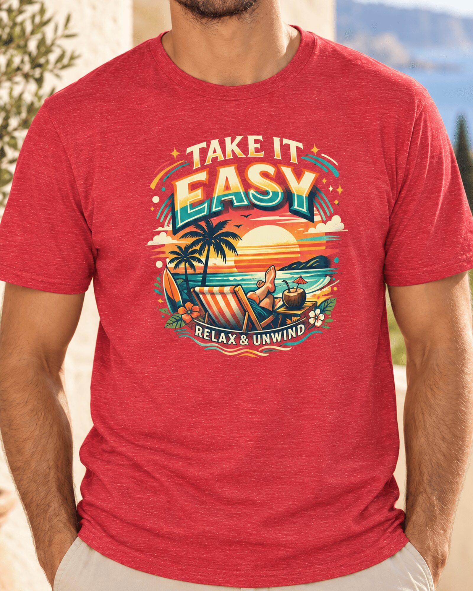 Take-it-easy-t-shirt-red Close-up of the Heather Red Take it Easy T-Shirt with a sunset, palm trees and beach chair graphic.