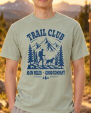 Man wearing the Bay Trail Club tee, front view showing the navy hiker and dog mountain graphic