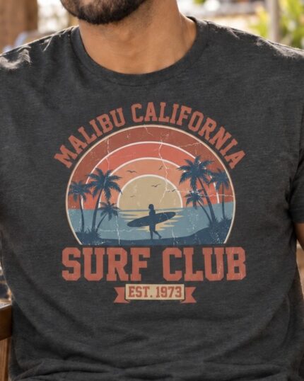 Close-up of the vintage Malibu Surf Club graphic on a Dark Heather T-shirt