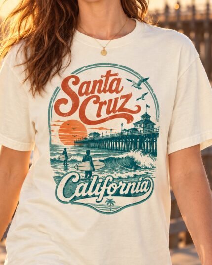 Woman wearing an ivory Santa Cruz California surf T-shirt at sunset