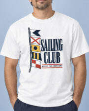 Man wearing the White Sailing Club Signal Flags T-shirt, front view, studio