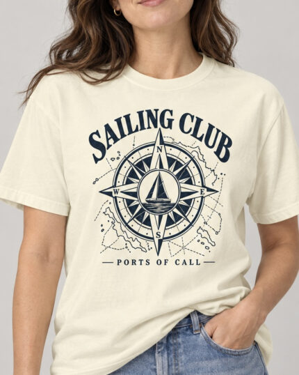 Woman wearing the Ivory Sailing Club Compass Rose T-shirt, front view, studio
