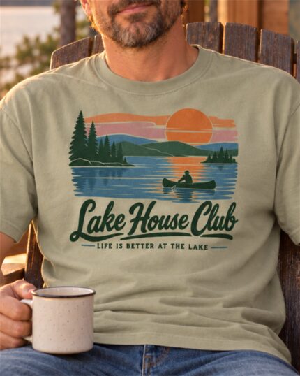 Man in the Khaki Lake House Club Sunset T-shirt with a coffee mug in an Adirondack chair, close-up