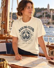 Woman in the Sailing Club Compass Rose T-shirt reading a nautical chart