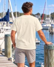 Back view of the Ivory Sailing Club Regatta T-shirt on a man at the marina