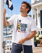 Man wearing the Sailing Club Signal Flags T-shirt by a yacht club flagpole