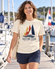 Woman wearing the Ivory Sailing Club Regatta T-shirt at a sunny sailing marina