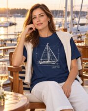 Woman wearing the Sail Plan blueprint T-shirt with a sweater over her shoulders