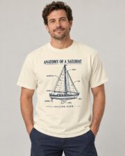 Man wearing the Ivory Anatomy of a Sailboat T-shirt, studio portrait