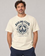 Man wearing the Ivory Sailing Club Compass Rose T-shirt, front view, studio