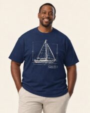 Man wearing the True Navy Sail Plan blueprint T-shirt, three-quarter view, studio