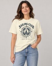 Woman wearing the Ivory Sailing Club Compass Rose T-shirt with jeans, studio