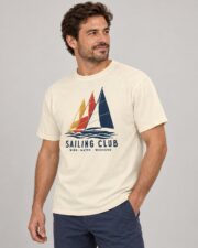 Man wearing the Ivory Sailing Club Regatta T-shirt, three-quarter view, studio