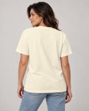 Back view of the Ivory Sailing Club Compass Rose T-shirt on a woman, studio