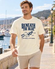 Man wearing the Ivory Beneath the Blue Scuba Diver T-shirt by the harbor
