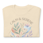 Close-up of the Calm & Serene watercolor botanical graphic on a folded Heather Natural t-shirt